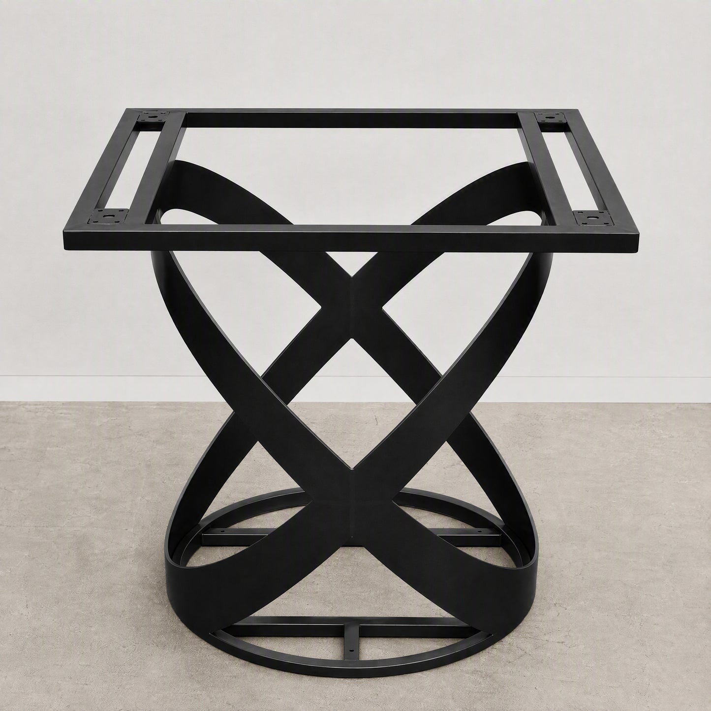 A black metal table base with a square top frame and an interlocking twisted X-shaped pedestal base, shown against a neutral studio backdrop.