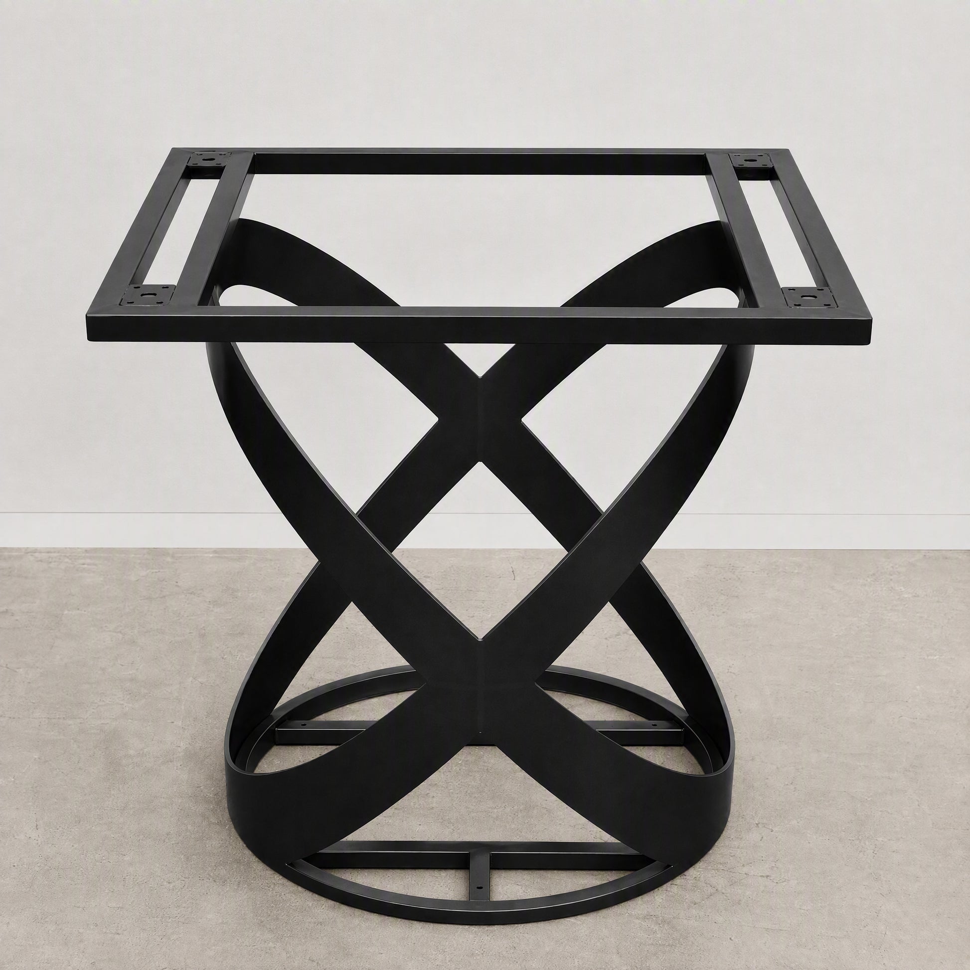 A black metal table base with a square top frame and an interlocking twisted X-shaped pedestal base, shown against a neutral studio backdrop.
